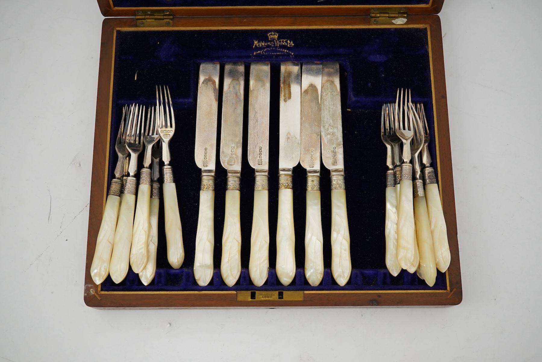 Twelve pairs of Victorian mother of pearl handled silver dessert eaters, by Mappin & Webb